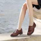 Women's Brogue Loafers with Fringed Cap & Cushioned Footbed - Outdoor Seated Pose