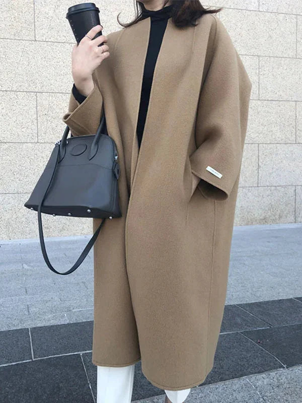 Women's Long Wool Coat with Relaxed Fit & Wide Sleeves - Side Walking Pose