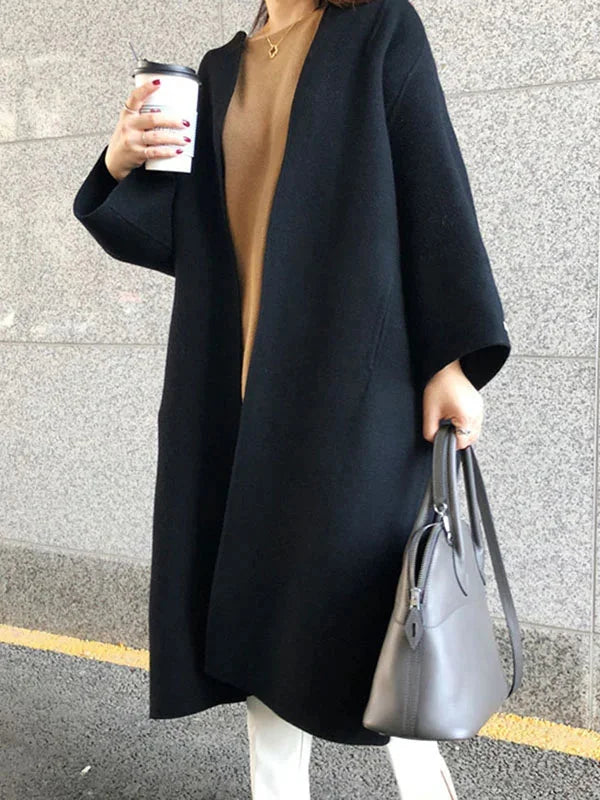 Black Women's Long Wool Coat with Relaxed Fit & Wide Sleeves - Front Coffee Pose