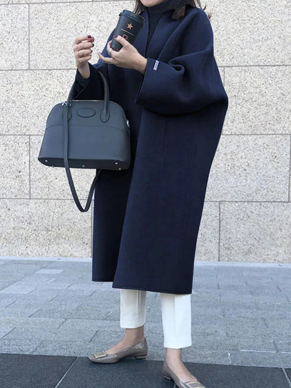 Navy Women's Long Wool Coat with Relaxed Fit & Wide Sleeves - Front Pose Handbag