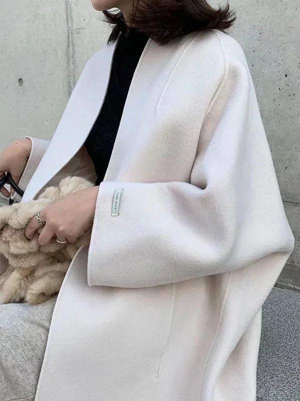 White Women's Long Wool Coat with Relaxed Fit & Wide Sleeves - Close Up Sleeve Detail