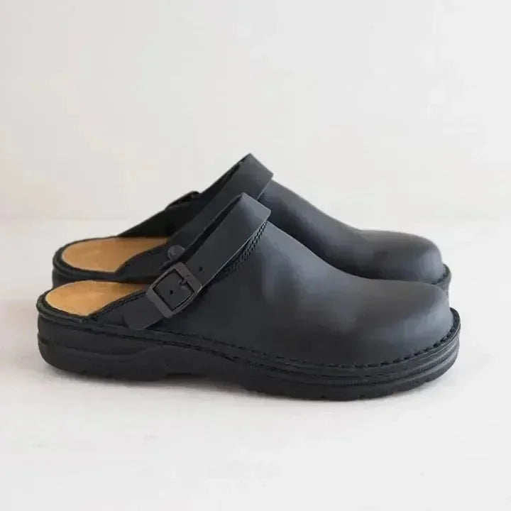 Black Men's Leather Mules with Buckle Strap & Slip-On Design — Reid - Side Profile Pair