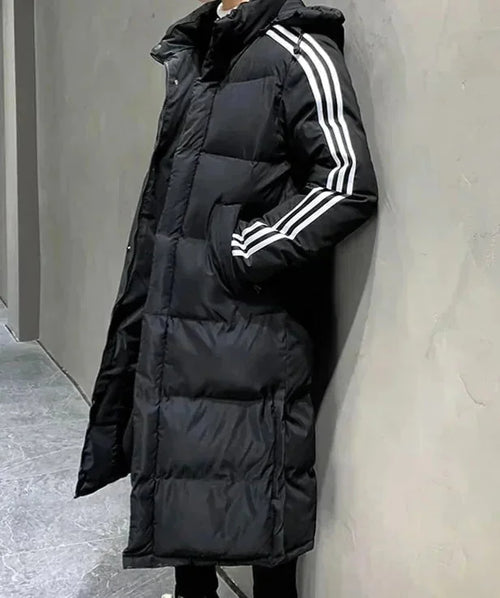 Black Women's Long Winter Coat with Hooded Design & Relaxed Fit - Side Lean Wall
