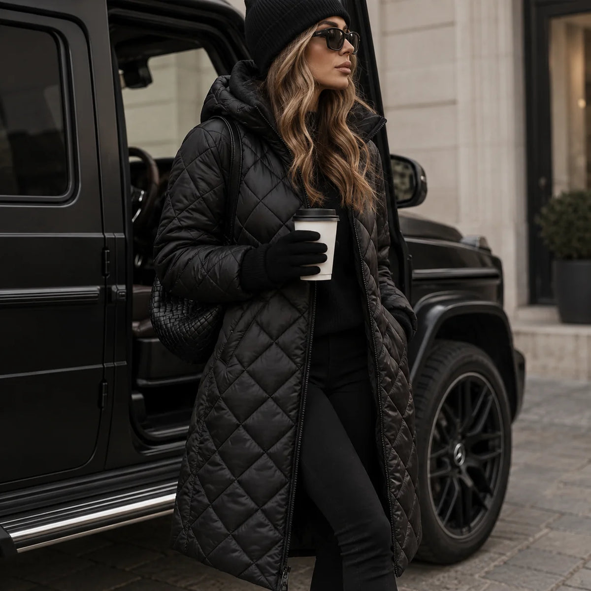 Black Women's Long Quilted Puffer Coat with Hooded Collar & Relaxed Fit - Front Pose Vehicle