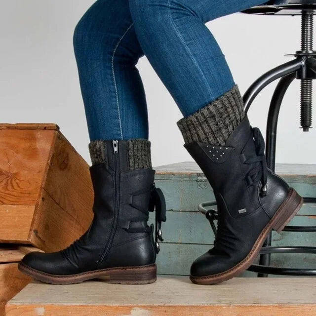 Black Women's Lace-Up Winter Boots with Knit Cuff & Side Zip Detail - Seated Stool Crossed Leg