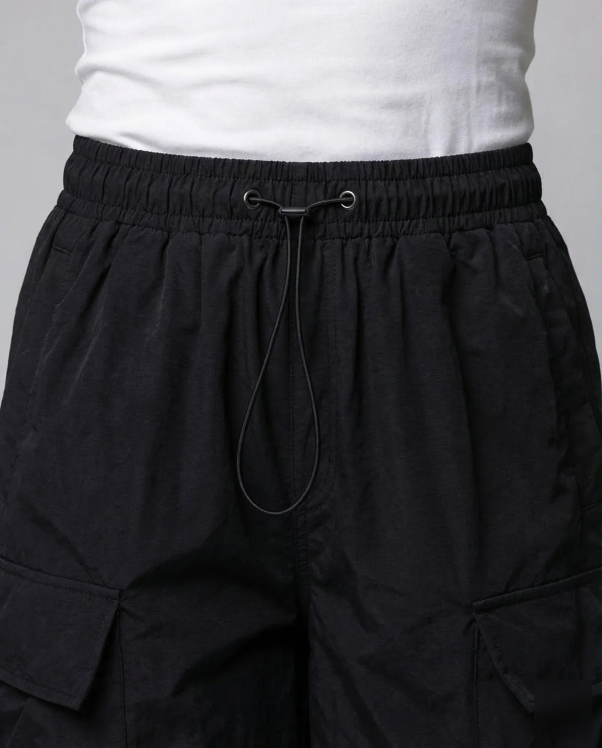 Black Women's Oversized Cargo Pants with Drawstring Waist & Flap Pockets — Layla - Waistband Drawstring Detail
