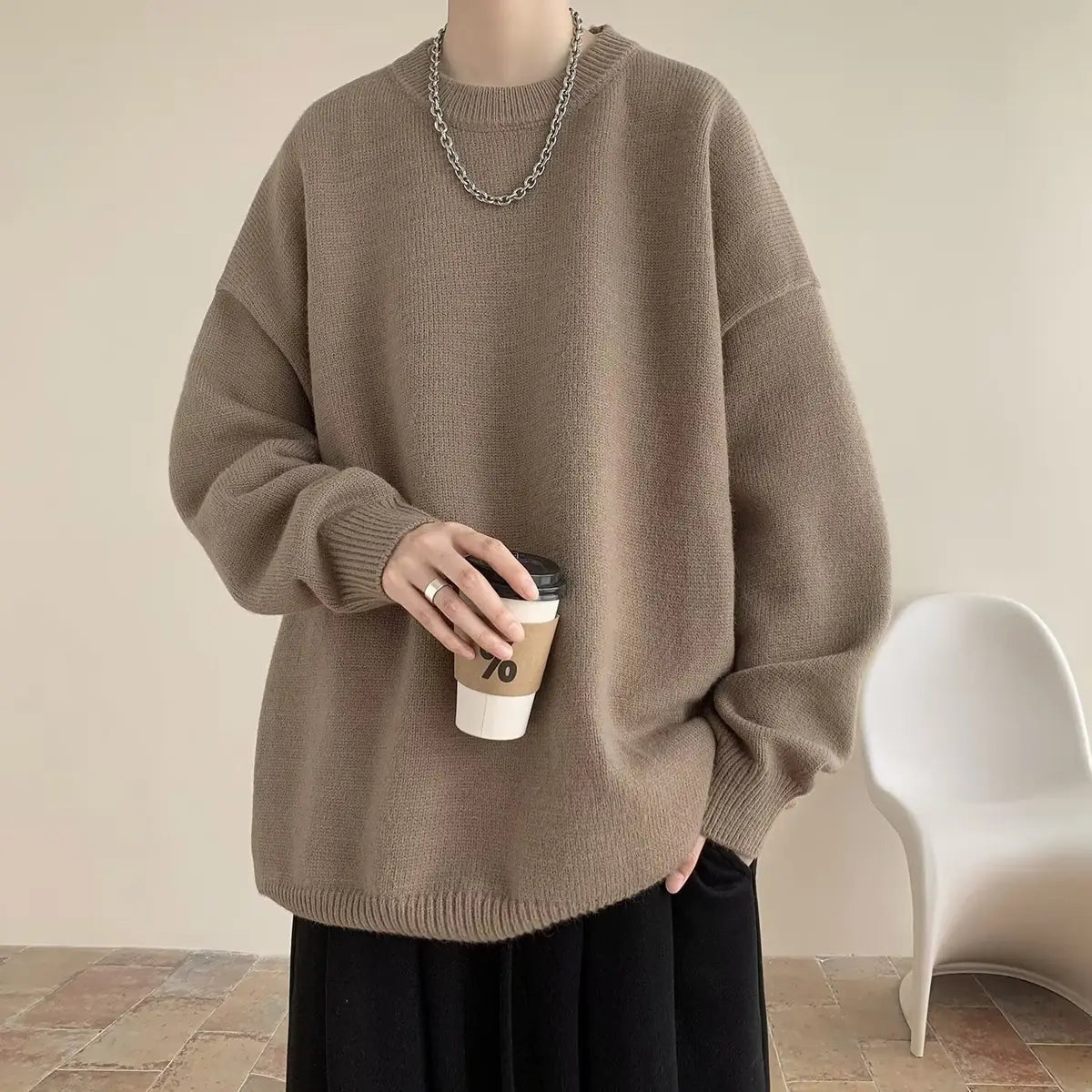 Light Brown Women's Oversized Sweater with Round Neckline & Stretchy Cuffs - Worn Holding Coffee