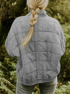 Women's Oversized Quilted Jacket with Stand Collar & Zip Pockets - Back Braid Pose