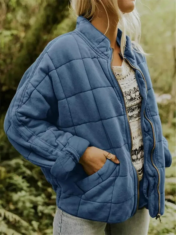 Dark Blue Women's Oversized Quilted Jacket with Stand Collar & Zip Pockets - Front Pocket Pose
