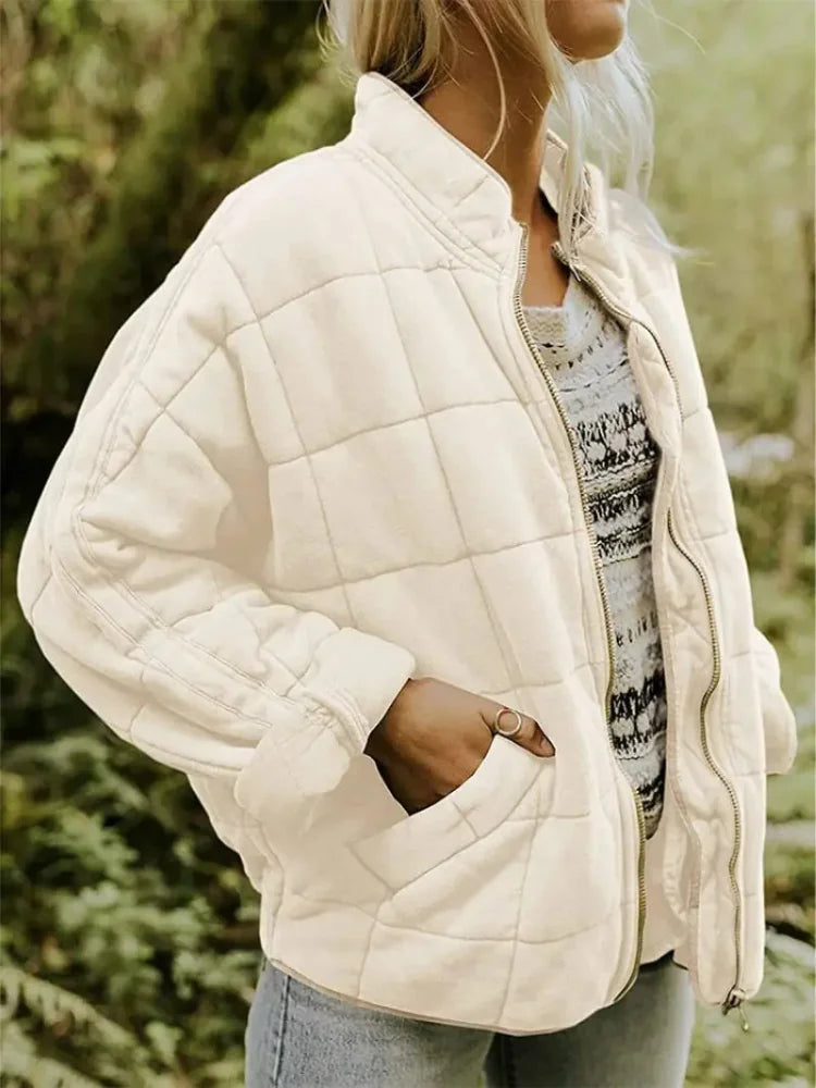White Women's Oversized Quilted Jacket with Stand Collar & Zip Pockets - Front Side Pose