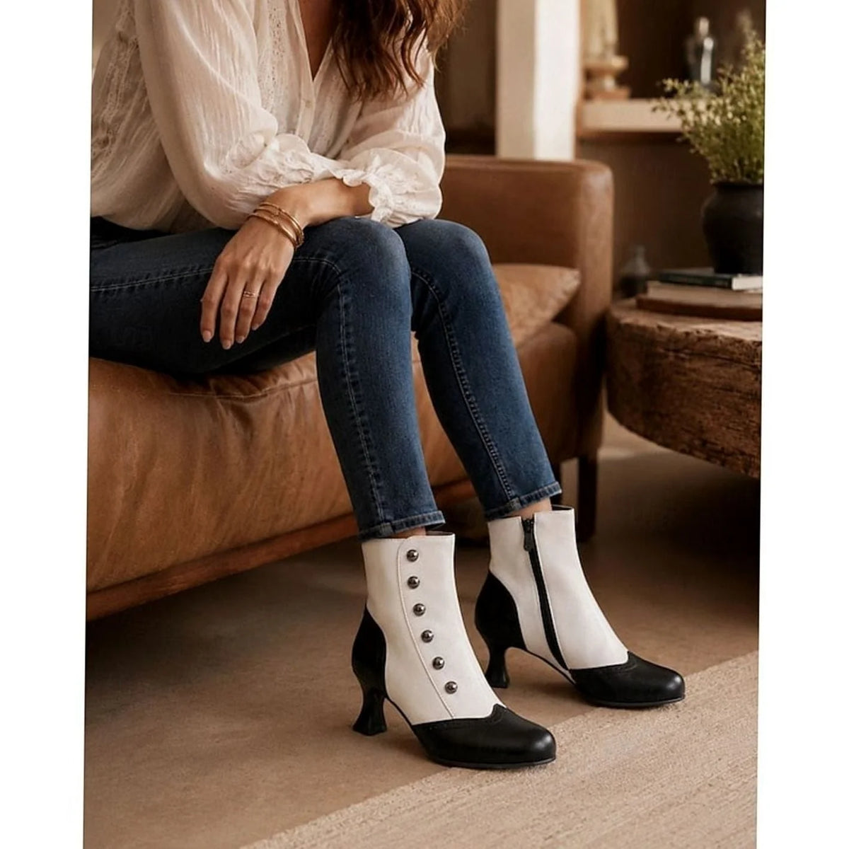 Women's Two-Tone Buttoned Ankle Boots with Spool Heel & Side Zip - White Worn Seated Lifestyle